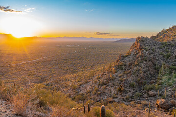 Colorful and beautiful sunset over Gates Pass, Tucson, AZ, with saguaro and cholla cactus