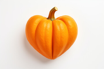 delicious orange pumpkin in the shape of a heart on a white isolated background,the concept of healthy nutrition,food styling,advertising banners for valentine's day