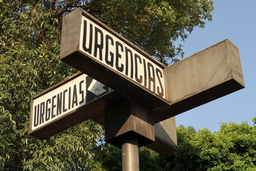 Sign marking the emergency area of a hospital, Urgencias translates to Emergencies, Puebla, Mexico