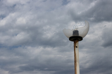 Broken street lamp with a bulb