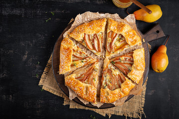 Galette with pear and blue cheese dipped in honey. Healthy eating. Top view