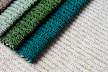 Colorful samples of upholstery fabrics close-up.
Bright collection  of corduroy fabric.
