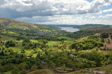 Fototapeta na wymiar Ambleside and Windermere in the sun seen from the slopes of Nab Scar, Lake District, UK