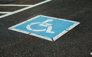 wheelchair symbol on blue background representing accessibility and inclusivity
