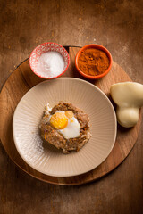minced meat nest with scamorza cheese and egg
