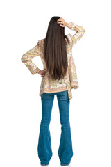 back view of casual woman with long hair scratching head and thinking