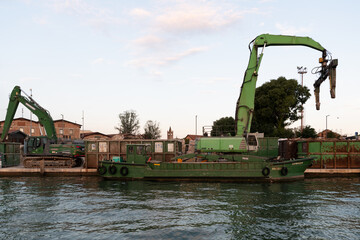 Green crane. Construction works
