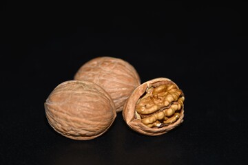 walnuts on black background