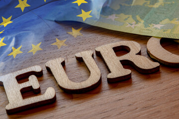 European euro currency theme, euro word concept made of wooden letters euro on wooden background...