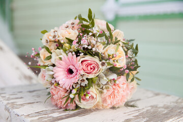 Close Up of a Muted Wedding Bouquet with Pink Flowers.