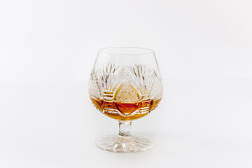 Luxury glass with rum on a white background