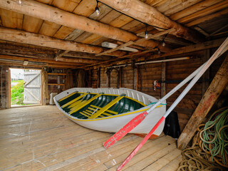 A Punt Style rowboat inside a boathouse on Joe Batt's arm on Fogo Island Newfoundland-Labrador