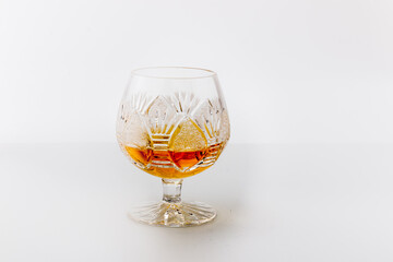 Luxury glass with rum on a white background