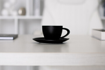 
Black cup of coffee on office table for business man
