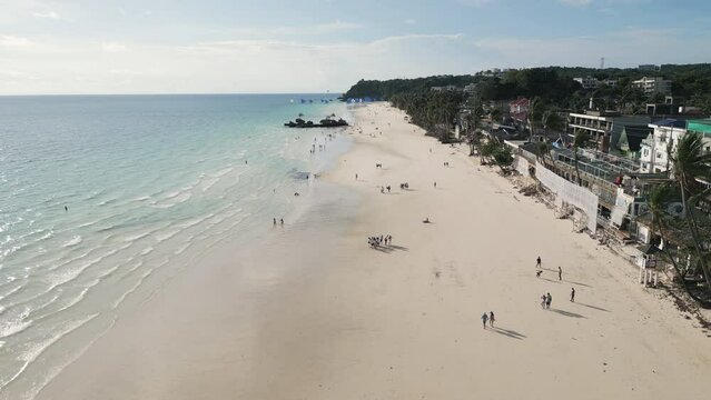 Picturesque aerial video of a tropical sandy beach on the west coast of Boracay island, Philippines