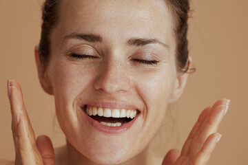 happy modern woman with wet face washing