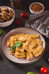 Alternative soy meat with rice on a plate on the table  vertical view