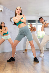 Fototapeta premium Young boys and girls performing contemporary dance in studio