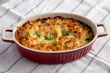 Homemade Scalloped Potatoes with Cheese and Parley, side view.