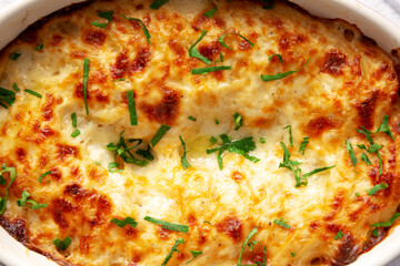 Homemade Scalloped Potatoes with Cheese and Parley, top view. Close-up.