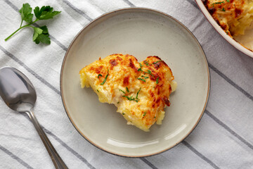 Homemade Scalloped Potatoes with Cheese and Parley, top view.