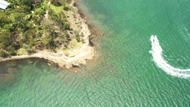 Lakeshore cape in Murrays beach town on Lake Macquarie – aerial panorama 4k.
