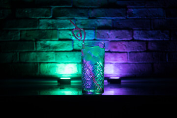 colorful cocktail in glass on dark background or Glasses of cocktails on bar background.Party club...