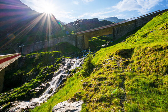 cascade of a balea stream in morning light. transfagarasan road through mountains of romania in summer