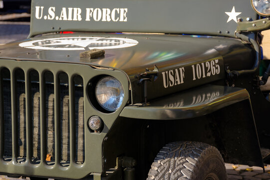 uzhgorod, ukraine - 31 oct 2021: close-up of a military vehicle grille and headlights. old us air force jeep with star on the hood