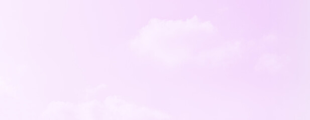 Pink purple sky with white fluffy cloud. Panoramic colourful soft sweet summer sky. Romance Love Valentine backdrop. Beautiful nature. Clear cloudscape cumulus sky with copy space.