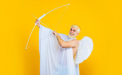 Love, passion, valentines day concept. Bearded man in angel costume with bow and arrows. Valentines...