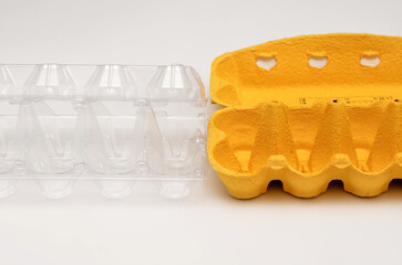 plastic and paper packaging for eggs on a white background