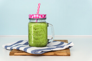 Colourful smoothie in a jar with a straw