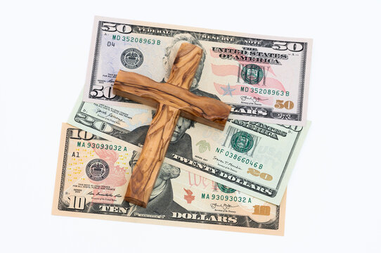 Banknotes with wooden cross