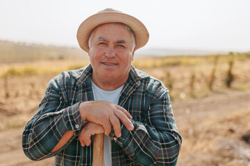 Fototapeta premium Happy and Genuine Senior Hispanic Farmer's Portrait with a Grin
