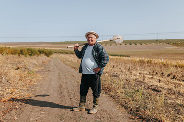 The Essence of Farming A Senior Farmer's Serene Stance Amidst Farmland