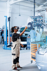 Qualified engineer in repair shop using VR googles and augmented reality hologram to visualize car...