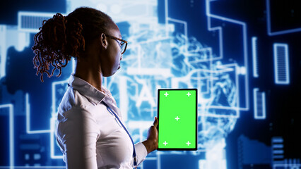 Admin updating AI systems using mockup tablet, writing intricate binary code scripts. Engineer...