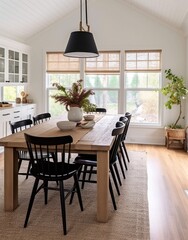 Fototapeta premium Black spindle chairs with a wood table and white vase centerpiece