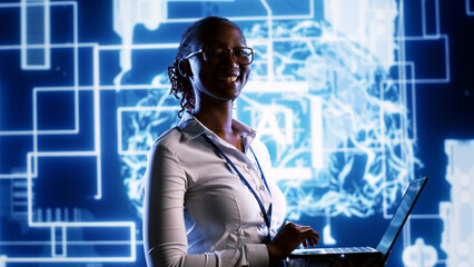 Portrait of happy engineer updating AI systems, writing intricate binary code scripts on laptop....
