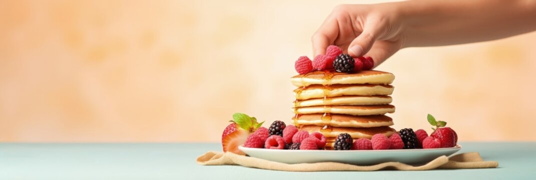 Stack of pancakes with berries. Advertising banner, web banner. Lush delicious pancakes with blueberries, raspberries and syrup for homemade breakfast