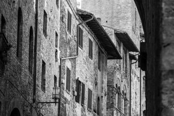 Fototapeta na wymiar Facade of typical medieval residential houses in downtown San Gimignano
