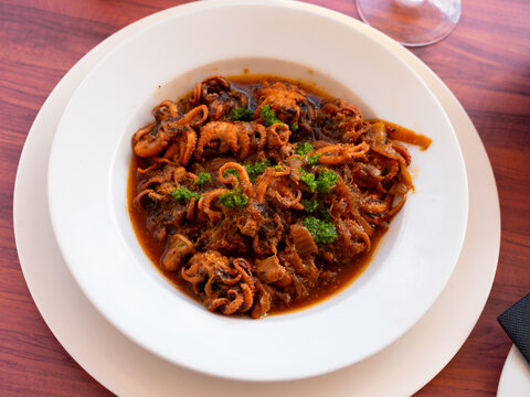 Pulpitos encebollados, traditional spanish onion soup with baby octopuses