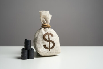 Oil barrels and dollar money bag. Trade and transportation of oil. Buying futures for sale. Profit...