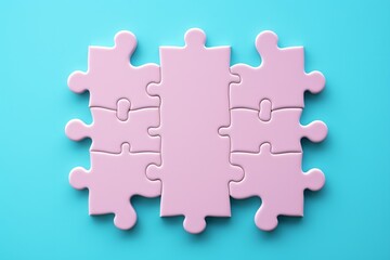 Pink puzzle pieces on blue background
