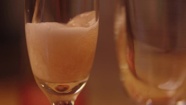 Champagne being poured into flutes for valentines day