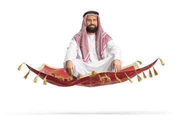 Bearded arab man sitting on a magic carpet and floating