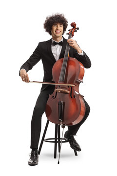 Young man sitting on a chair with a chello and a fiddle