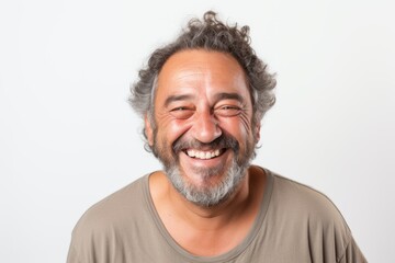 Portrait of a man with gray hair and beard laughing on white background