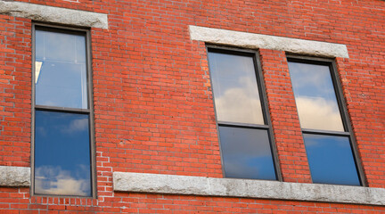 urban brick building, symbolizing stability and growth in commercial real estate